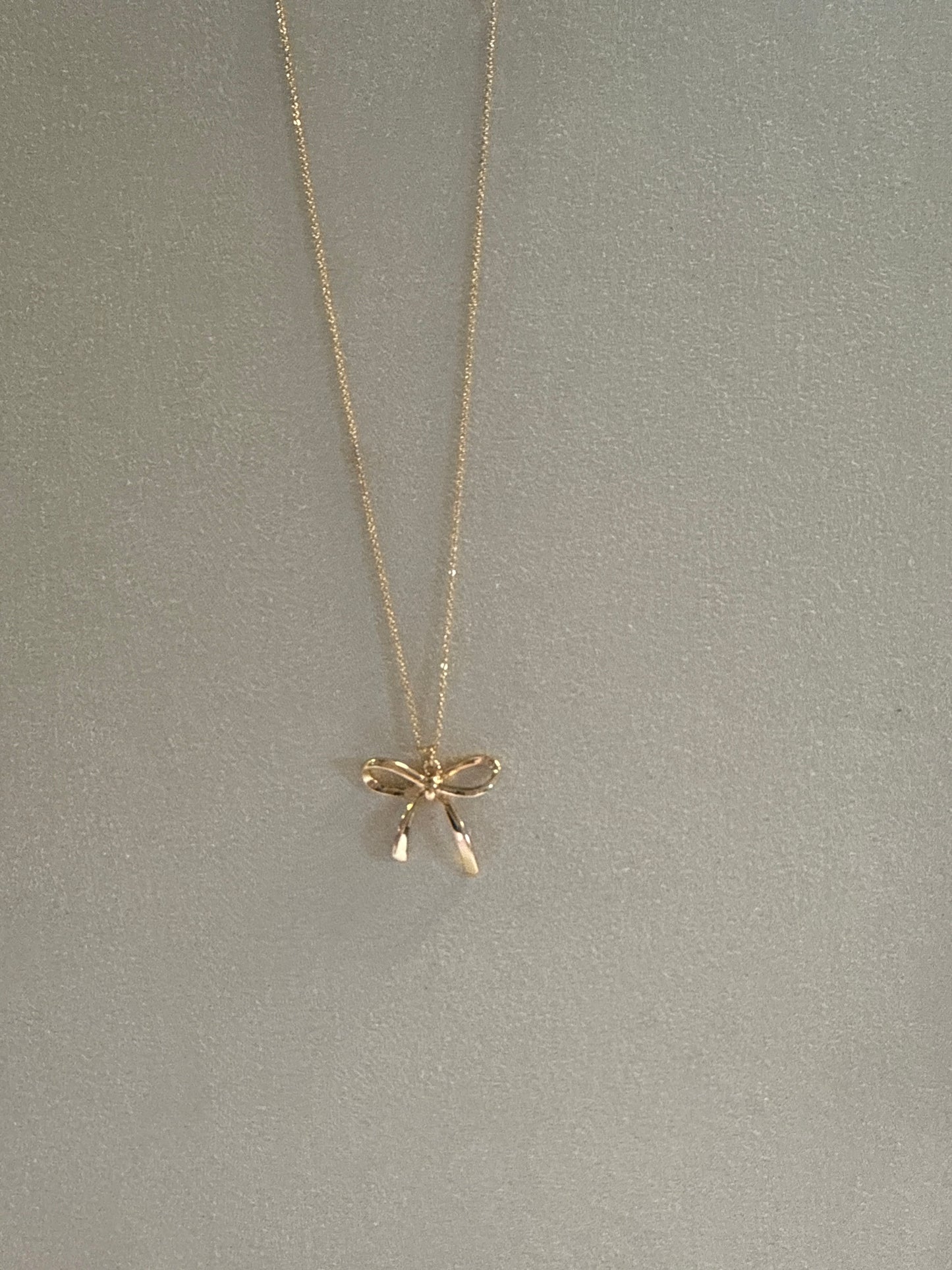 Gold Chain with Gold Bow Pendant